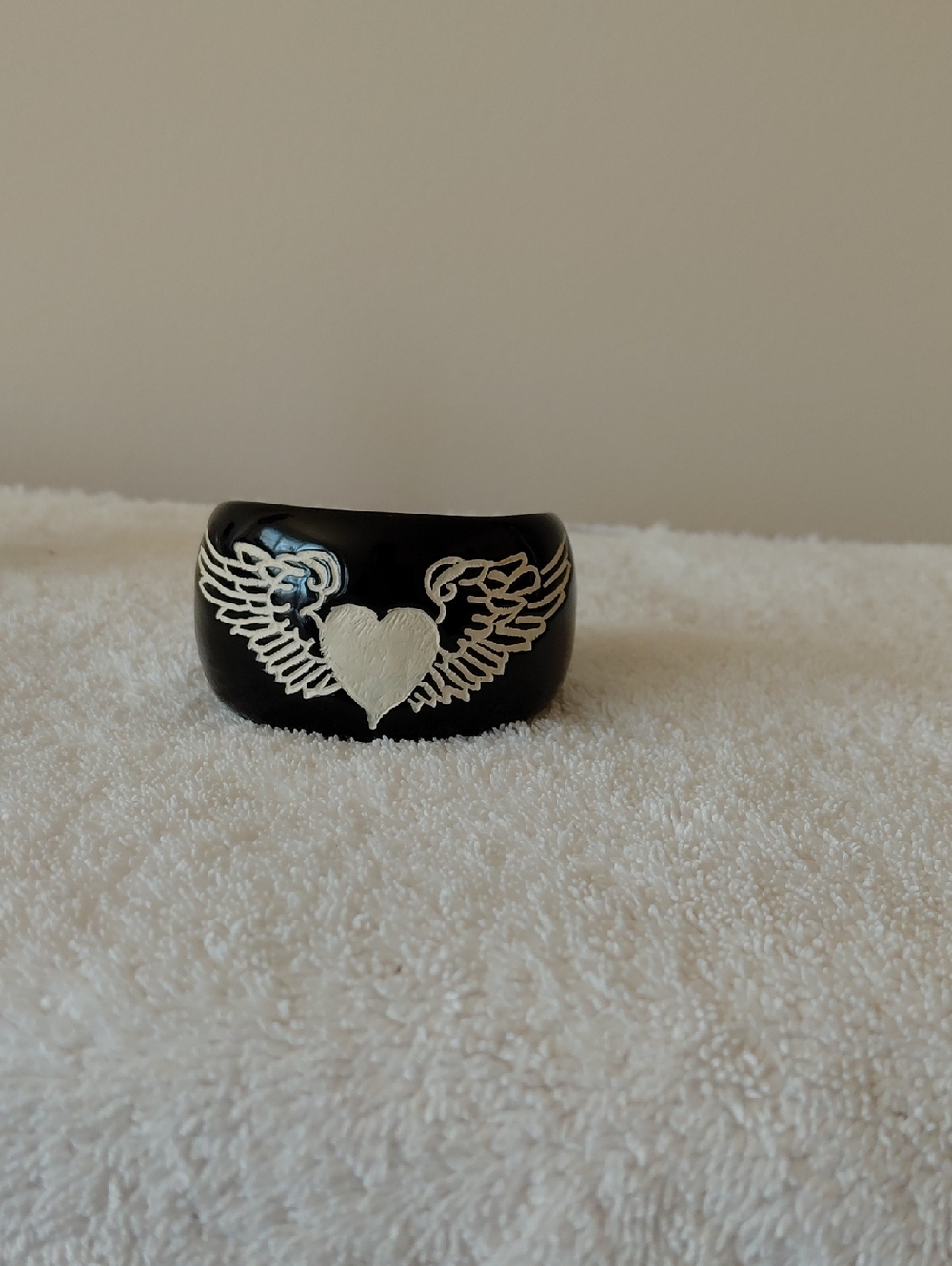 Trish McEvoy Black Resin Bangle with White Winged Heart